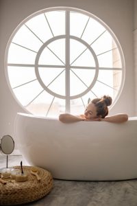 a woman relaxing in the bathtub